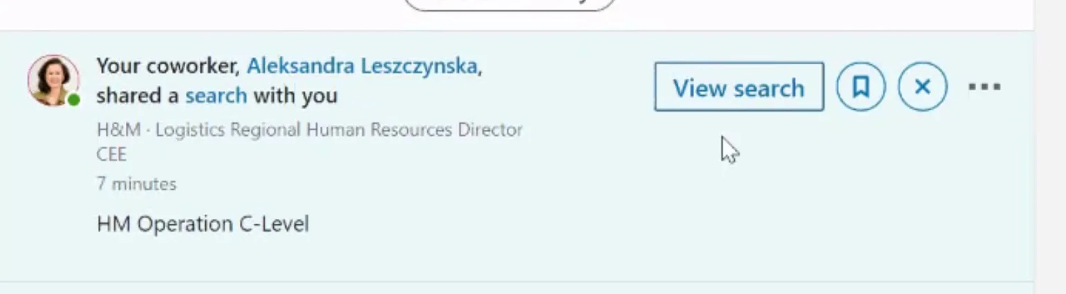 A Sales Navigator notification: 'Your coworker shared a search with you' with the company name and the note as its content, next to a View search button