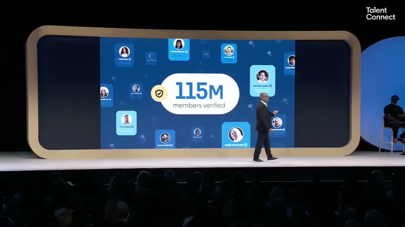Dan Shapero on stage in front of a slide reading 115M members verified, surrounded by profile photos with verification badges